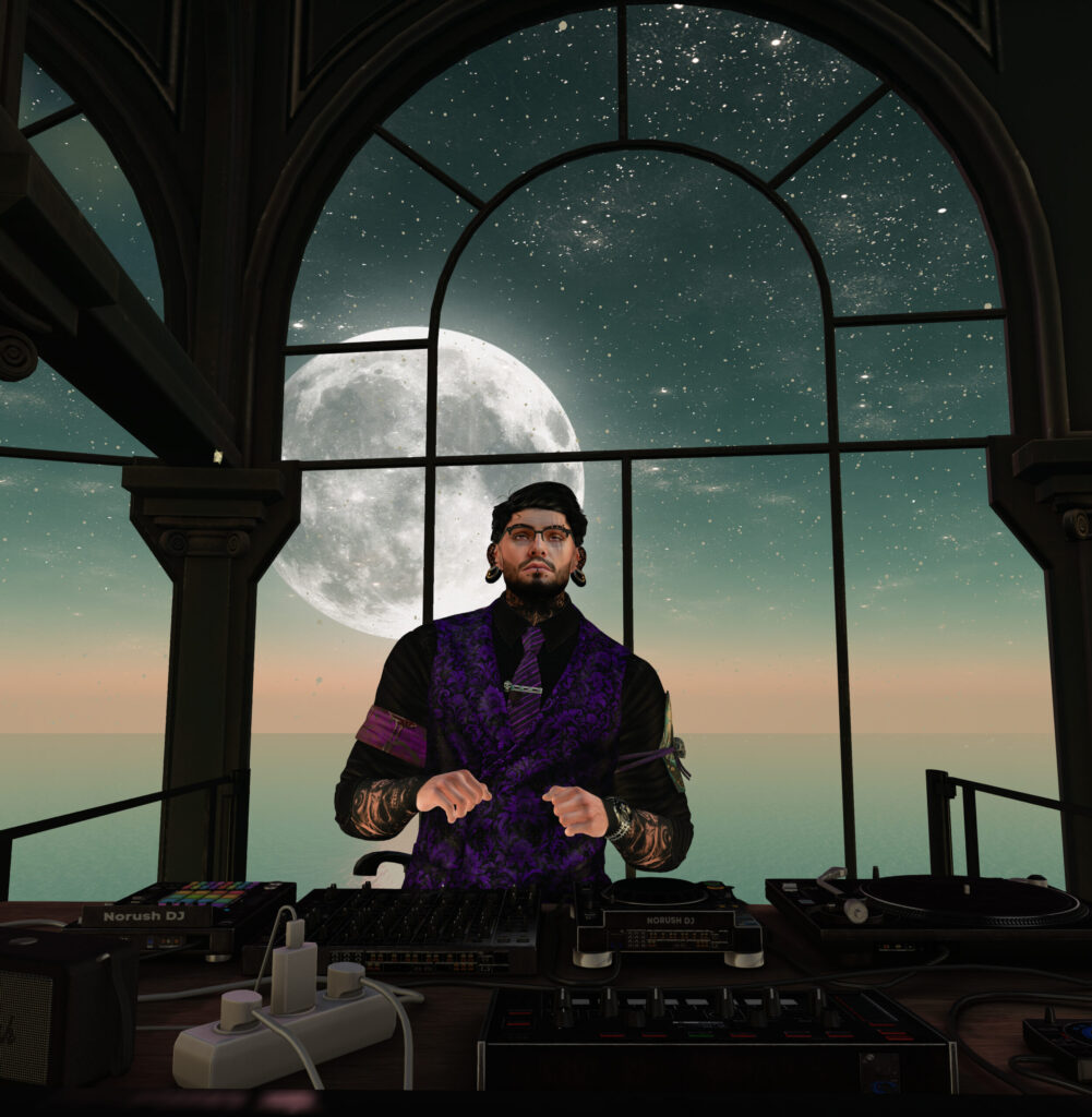 A DJ framed by the moonlit windows of Ofrenda
